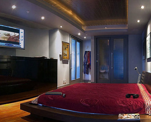 Home automation and custom home audio video tv solutions - plasma tv in bed.
