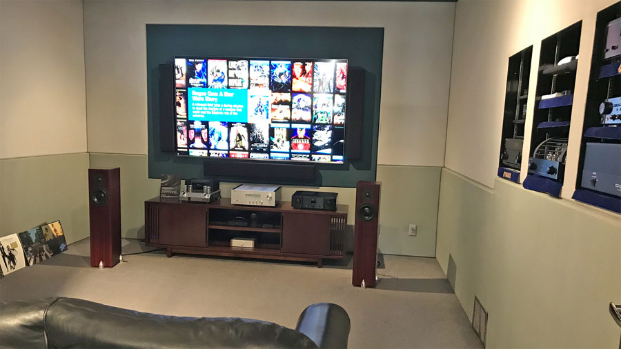 Stealth Home Theater Demo Room near downtown Calgary, Alberta. Shows off custom acoustic fabric walls, a Samsung 82