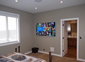 K&W Audio's clean installation of an 8K LED TV, floating elegantly in a Calgary living space.