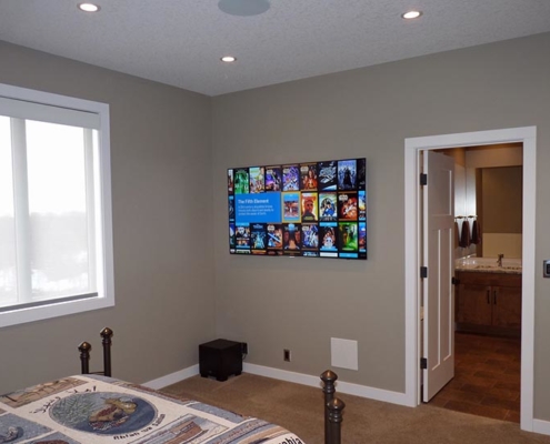 K&W Audio's clean installation of an 8K LED TV, floating elegantly in a Calgary living space.