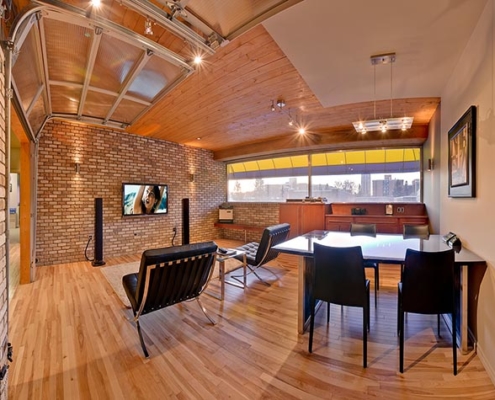 Spacious Calgary living room featuring a wall-mounted 8K TV for immersive viewing.