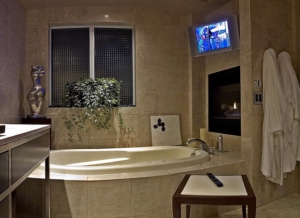 8K TV in a Calgary home's bathroom, installed by K&W Audio.